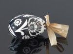 Black decorated egg with a black and white flower (created on a goose eggshell)