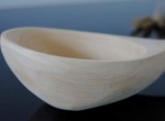 Ladle with slightly curved holder 
