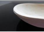 A medium sized bowl made of alder wood