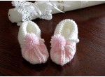 Shoes with pink yarn decorations