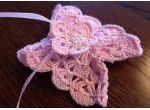 Pink crochet candle cover