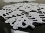 A set of white crochet napkins